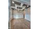 Dining room featuring a modern light fixture, wainscoting, and hardwood floors at 649 Riverwood Dr, Clayton, NC 27527