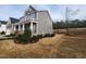 Two story home exterior with well maintained landscaping and yard at 649 Riverwood Dr, Clayton, NC 27527