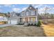 Beautiful two-story home with a three-car garage, a welcoming front porch and professional landscaping at 649 Riverwood Dr, Clayton, NC 27527