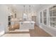 Bright, white kitchen featuring stainless appliances, a center island, and plenty of cabinet storage at 649 Riverwood Dr, Clayton, NC 27527