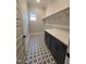 Charming laundry room with modern cabinetry, patterned floors, and ample counter space at 649 Riverwood Dr, Clayton, NC 27527