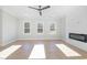 Spacious living room with a decorative fireplace and hardwood floors at 649 Riverwood Dr, Clayton, NC 27527