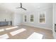 Bright living room with wood floors, wet bar, and natural light from large windows at 649 Riverwood Dr, Clayton, NC 27527