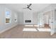 Bright living room featuring a modern fireplace and a large windows with natural light at 649 Riverwood Dr, Clayton, NC 27527