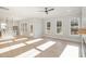 Spacious open concept living room featuring hardwood floors, neutral tones, and abundant natural light at 649 Riverwood Dr, Clayton, NC 27527