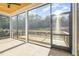 Covered and screened outdoor porch overlooking a backyard and trees at 649 Riverwood Dr, Clayton, NC 27527