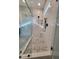 Luxurious shower with glass enclosure, rain shower head, and modern tile design at 649 Riverwood Dr, Clayton, NC 27527