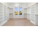 Spacious walk-in closet with built-in shelving and a large window at 649 Riverwood Dr, Clayton, NC 27527