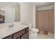 Clean bathroom with dark vanity and shower/tub combo at 71 Nolan Ct, Lillington, NC 27546