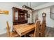 Bright dining room featuring a large wooden table and hutch at 71 Nolan Ct, Lillington, NC 27546
