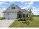 Craftsman style home with stone accents and a two-car garage at 71 Nolan Ct, Lillington, NC 27546