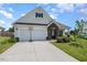 Two-car garage and inviting front entryway at 71 Nolan Ct, Lillington, NC 27546
