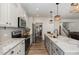 Open kitchen with granite island and stainless steel appliances at 71 Nolan Ct, Lillington, NC 27546