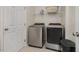 Laundry room with washer, dryer, and shelving at 71 Nolan Ct, Lillington, NC 27546