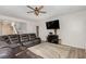 Spacious living room featuring a large sectional sofa and flat-screen TV at 71 Nolan Ct, Lillington, NC 27546