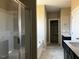 Spacious bathroom featuring double vanity with dark cabinets and a separate shower and tub at 981 Olive Branch Dr, Smithfield, NC 27577