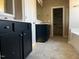 Spacious bathroom featuring double vanity with dark cabinets and a separate shower and tub at 981 Olive Branch Dr, Smithfield, NC 27577