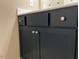 Bathroom vanity featuring a navy blue cabinet and white countertops with modern hardware at 981 Olive Branch Dr, Smithfield, NC 27577