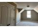 Unfinished bedroom features a vaulted ceiling, double door closet, and natural light at 981 Olive Branch Dr, Smithfield, NC 27577