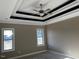 Bedroom with trey ceiling, ceiling fan, and dual windows offers natural light and comfort at 981 Olive Branch Dr, Smithfield, NC 27577