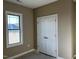 Bedroom with a window and double-door closet offering natural light and storage at 981 Olive Branch Dr, Smithfield, NC 27577
