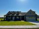 Inviting single-Gathering home featuring a two-car garage, well-maintained lawn, and a classic architectural design at 981 Olive Branch Dr, Smithfield, NC 27577