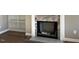 A close-up of a fireplace featuring a stone surround and adjacent built-in bookshelves at 981 Olive Branch Dr, Smithfield, NC 27577