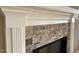 Stunning stone fireplace with detailed white mantel adds architectural interest to the living space at 981 Olive Branch Dr, Smithfield, NC 27577
