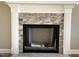 Stone fireplace with white mantle surround creates a cozy, inviting atmosphere in the home at 981 Olive Branch Dr, Smithfield, NC 27577