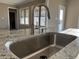 A contemporary kitchen island boasts a sleek stainless steel sink and a stylish faucet at 981 Olive Branch Dr, Smithfield, NC 27577
