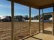 Relaxing screened-in porch with views of a spacious backyard and neighboring homes at 981 Olive Branch Dr, Smithfield, NC 27577