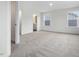 Bright bedroom with access to bathroom and carpet flooring at 448 La Maison Ave # 19, Wendell, NC 27591