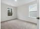 Bright bedroom with neutral walls and carpet at 448 La Maison Ave # 19, Wendell, NC 27591