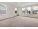 Large bedroom with multiple windows and wall-to-wall carpet at 448 La Maison Ave # 19, Wendell, NC 27591