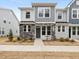 Two-story townhome with gray siding, stone accents, and a front walkway at 448 La Maison Ave # 19, Wendell, NC 27591