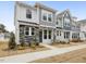 Two-story townhome with gray and white siding, stone accents, and a front walkway at 448 La Maison Ave # 19, Wendell, NC 27591