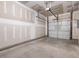 Attached garage with double door and overhead storage at 448 La Maison Ave # 19, Wendell, NC 27591