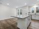 Open concept living room and kitchen with hardwood floors at 448 La Maison Ave # 19, Wendell, NC 27591