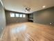 Spacious basement with hardwood floors, a wet bar, and large windows at 7208 Tanbark Way, Raleigh, NC 27615