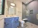 Bathroom with a glass-enclosed shower, a white sink vanity, and brushed gold fixtures at 7208 Tanbark Way, Raleigh, NC 27615