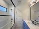 Bathroom featuring subway tile, marble countertop, and glass shower doors at 7208 Tanbark Way, Raleigh, NC 27615