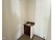 Bathroom with dark vanity and sink with marble countertops at 7208 Tanbark Way, Raleigh, NC 27615