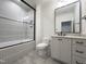 Bathroom featuring glass enclosed shower and white vanity with marble countertop at 7208 Tanbark Way, Raleigh, NC 27615