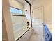 Modern bathroom with a white subway tile shower and a glass door with black trim at 7208 Tanbark Way, Raleigh, NC 27615