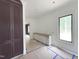 Spacious bathroom featuring a large built-in cabinet, white vanity, and a bright window at 7208 Tanbark Way, Raleigh, NC 27615