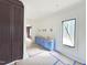 Bathroom with white walls, sconces, and cabinets, and with a view of hallway at 7208 Tanbark Way, Raleigh, NC 27615