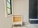 Bathroom featuring an incomplete vanity, natural light, and dark tiled shower at 7208 Tanbark Way, Raleigh, NC 27615