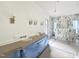 Bathroom under construction with marble shower, white vanities, and three sconces at 7208 Tanbark Way, Raleigh, NC 27615