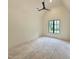 Bedroom features hardwood floors, a ceiling fan, and natural light from a window at 7208 Tanbark Way, Raleigh, NC 27615