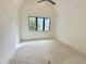 Bedroom featuring a large window and high vaulted ceilings at 7208 Tanbark Way, Raleigh, NC 27615